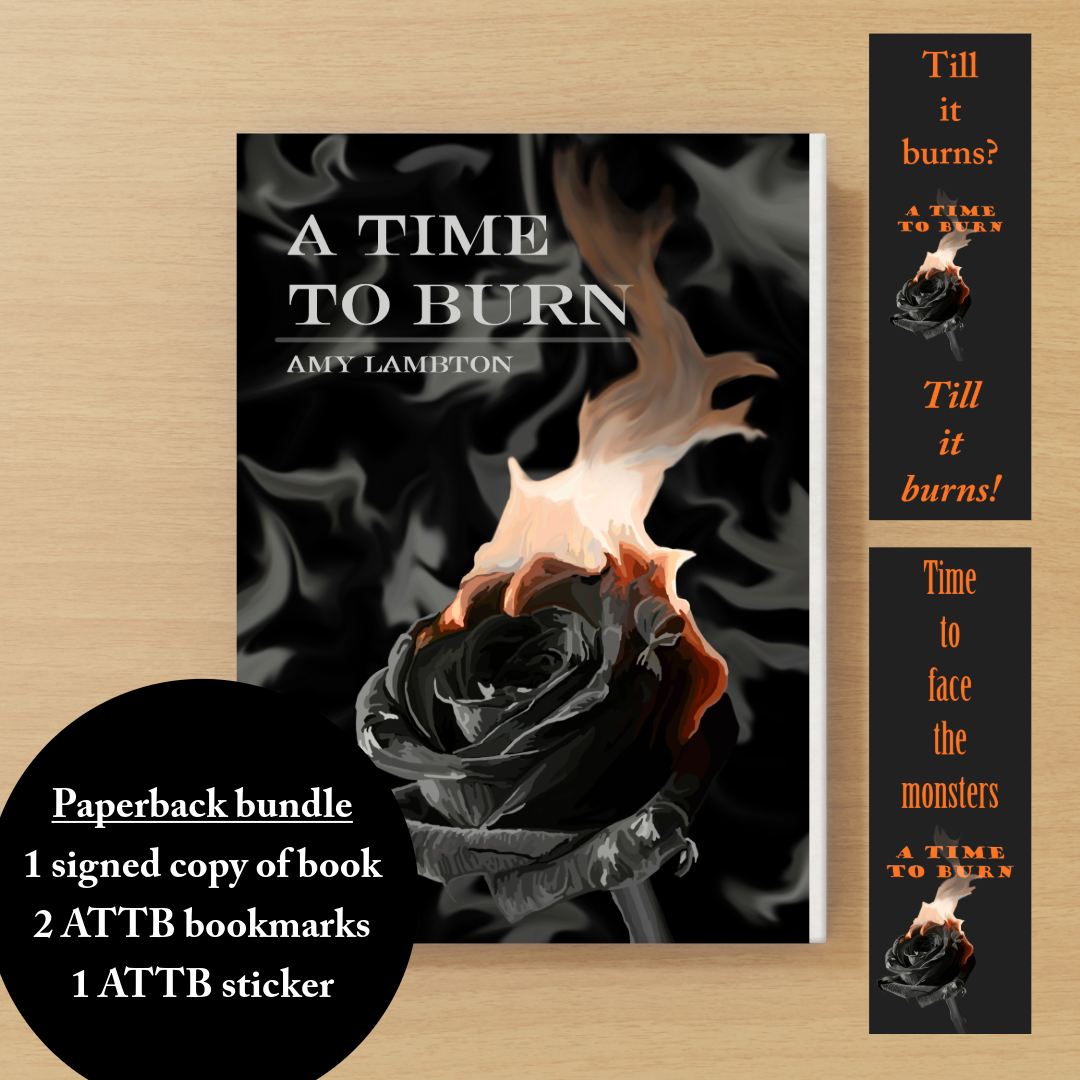 Book bundle with 'A Time to Burn' by Amy Lambton, including a signed copy, bookmarks, and a sticker on a wooden surface.